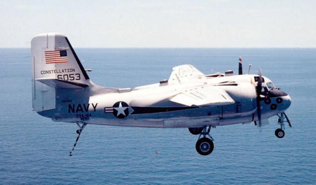 Grumman C-1A Trader approaching the U.S. aircraft carrier USS Constellation (CVA 64) ca. 1974 (US Navy)